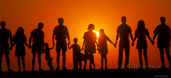large-family-silhouetted-at-sunset